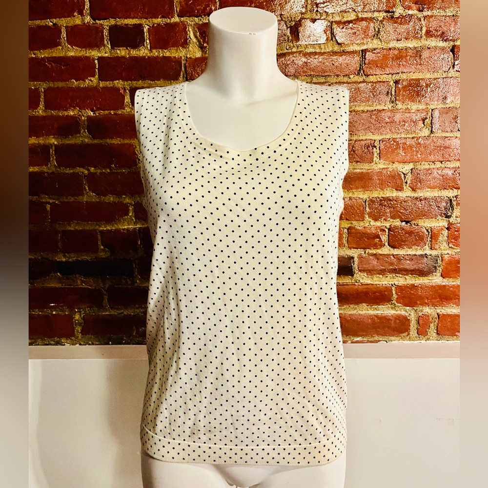 Woman’s Talbots classic white dotted blouse.